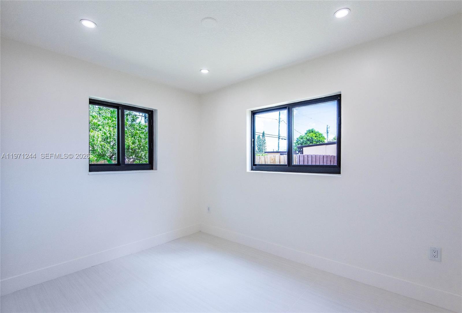 11861 Southwest 185th Terrace Miami, FL 33177 - Photo 23 of 34 an empty room with windows
