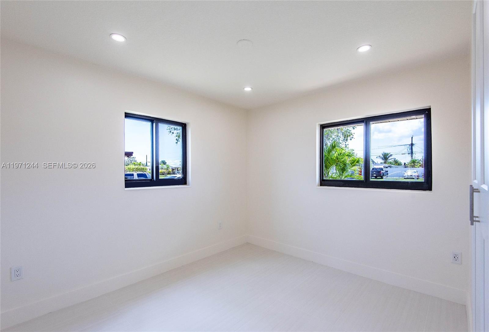 11861 Southwest 185th Terrace Miami, FL 33177 - Photo 25 of 34 an empty room with windows