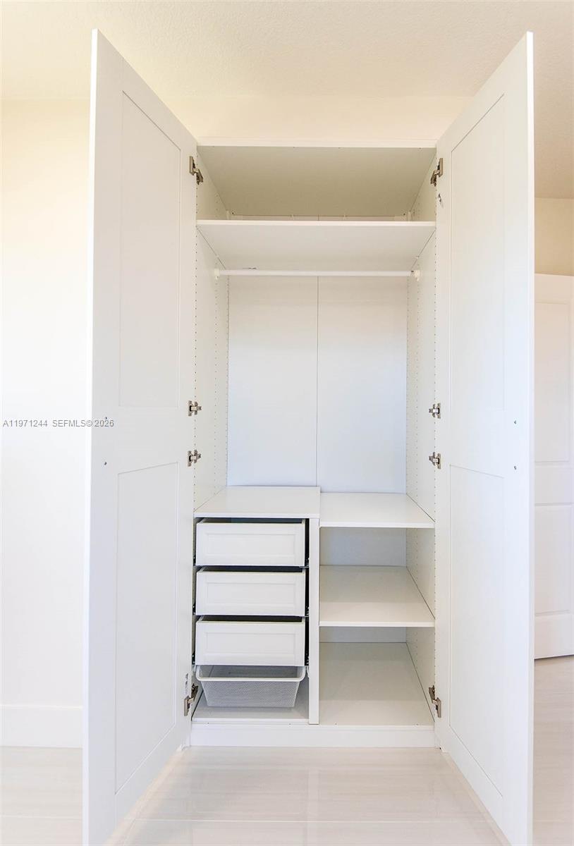 11861 Southwest 185th Terrace Miami, FL 33177 - Photo 26 of 34 a view of an empty walk in closet