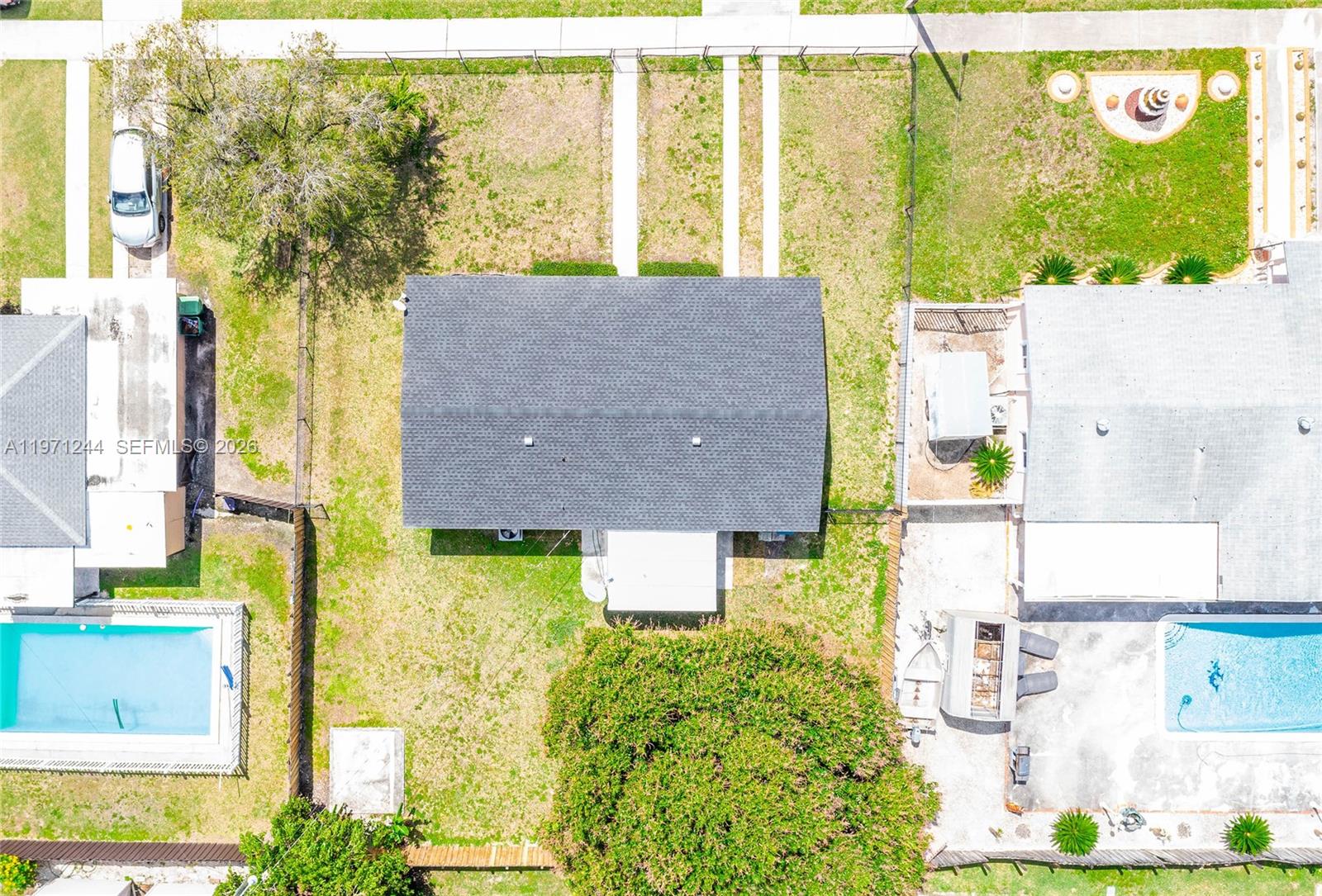 11861 Southwest 185th Terrace Miami, FL 33177 - Photo 27 of 34 a aerial view of a residential apartment building with a yard