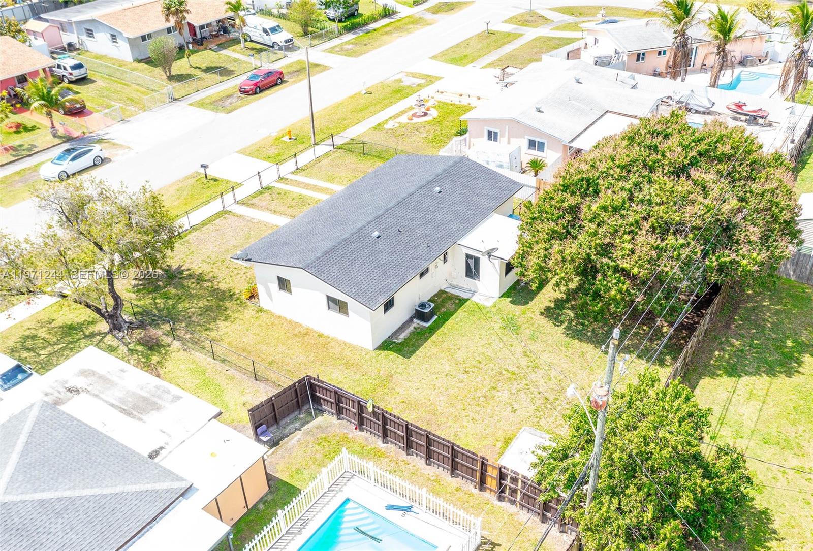 11861 Southwest 185th Terrace Miami, FL 33177 - Photo 30 of 34 a view of an house with swimming pool