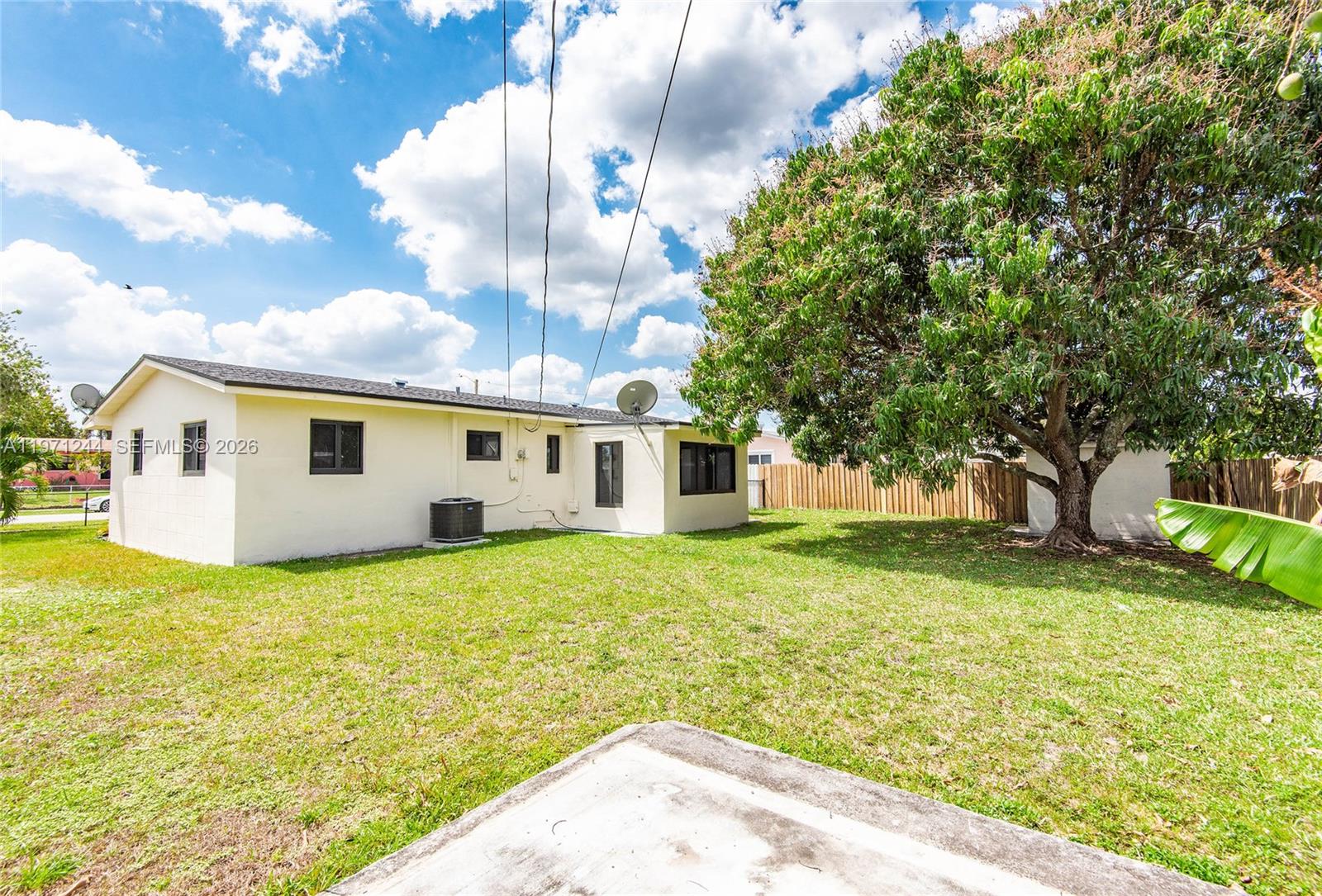 11861 Southwest 185th Terrace Miami, FL 33177 - Photo 6 of 34 a view of a house with a backyard