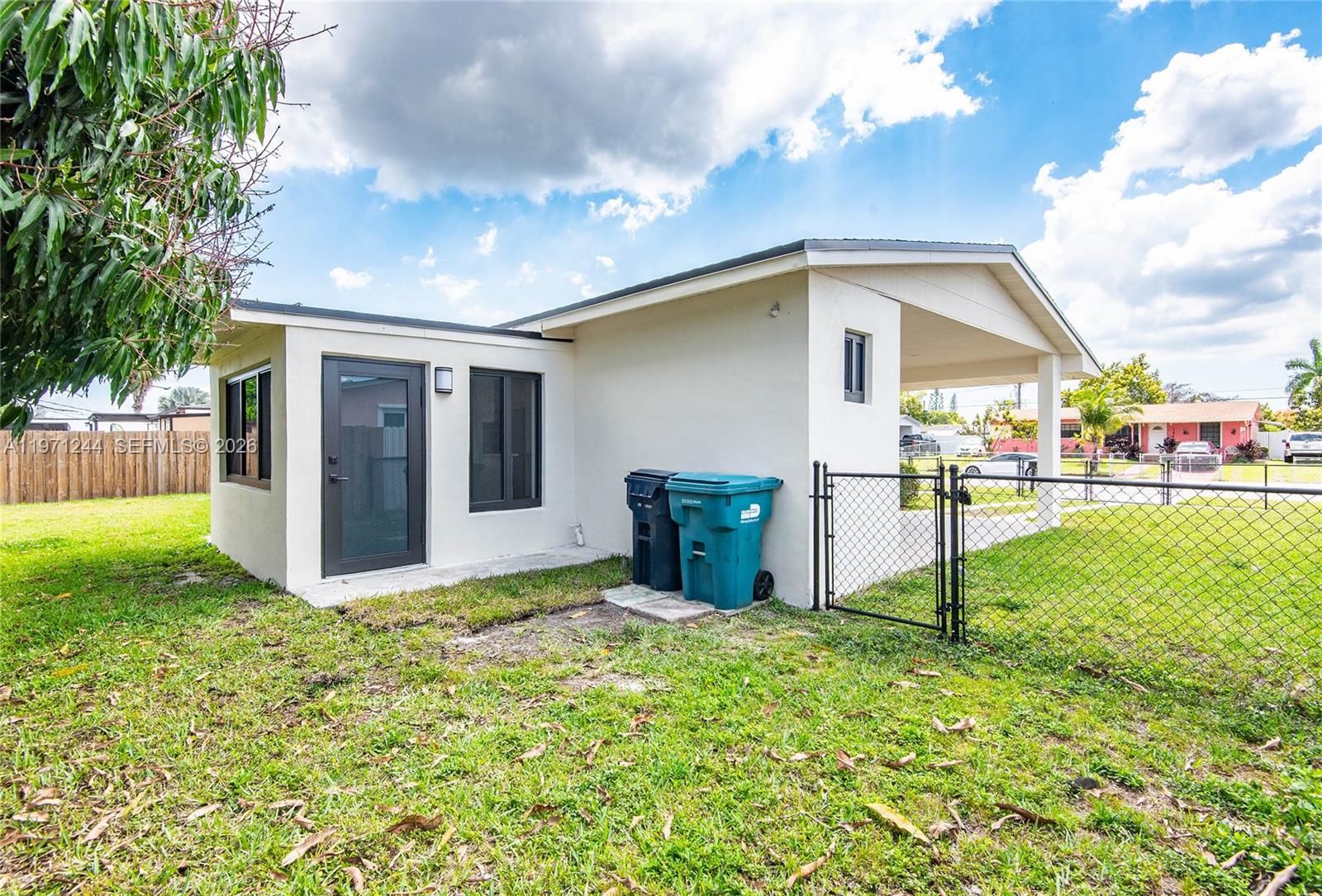 11861 Southwest 185th Terrace Miami, FL 33177 - Photo 8 of 34 a view of a backyard with a garden and plants