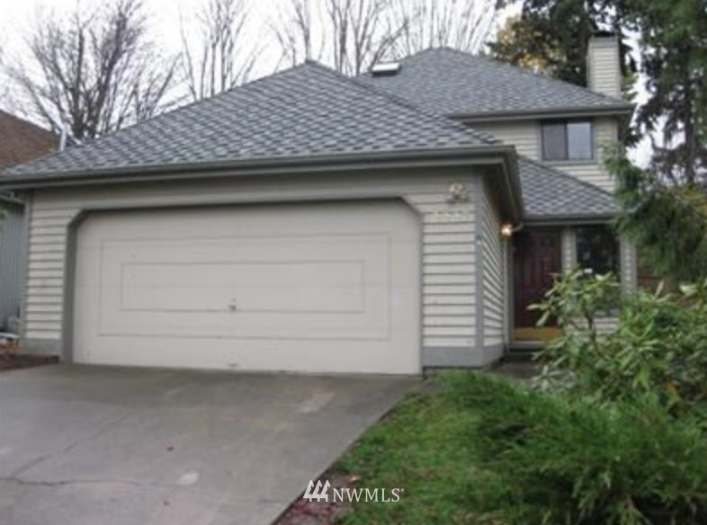 2227 Southeast 8th Place Renton, WA 98057 - Photo 2 of 21 a small white house with a outdoor space