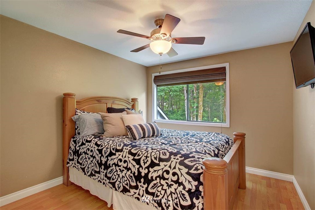 2227 Southeast 8th Place Renton, WA 98057 - Photo 13 of 21 a bedroom with a bed and a window