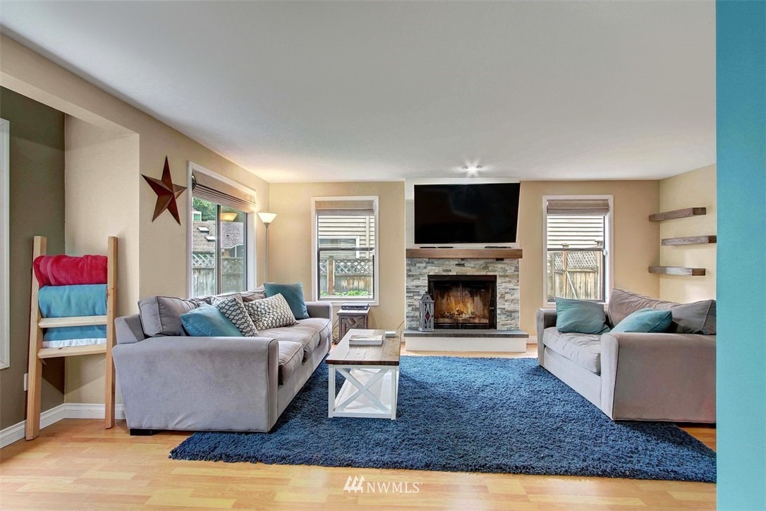2227 Southeast 8th Place Renton, WA 98057 - Photo 4 of 21 a living room with furniture and a fireplace
