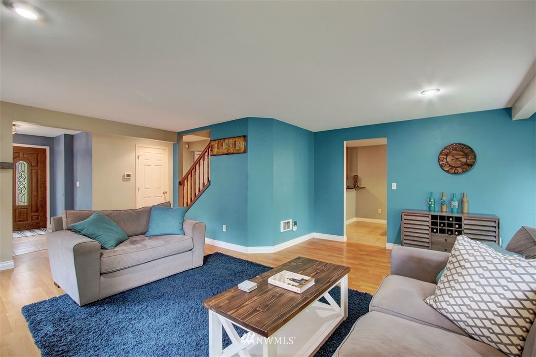 2227 Southeast 8th Place Renton, WA 98057 - Photo 6 of 21 a living room with furniture and a couch