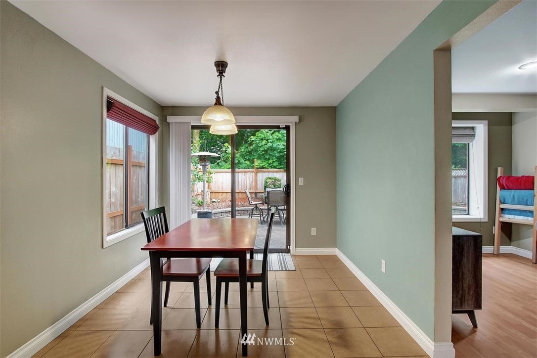 2227 Southeast 8th Place Renton, WA 98057 - Photo 9 of 21 a dining room with furniture window and wooden floor