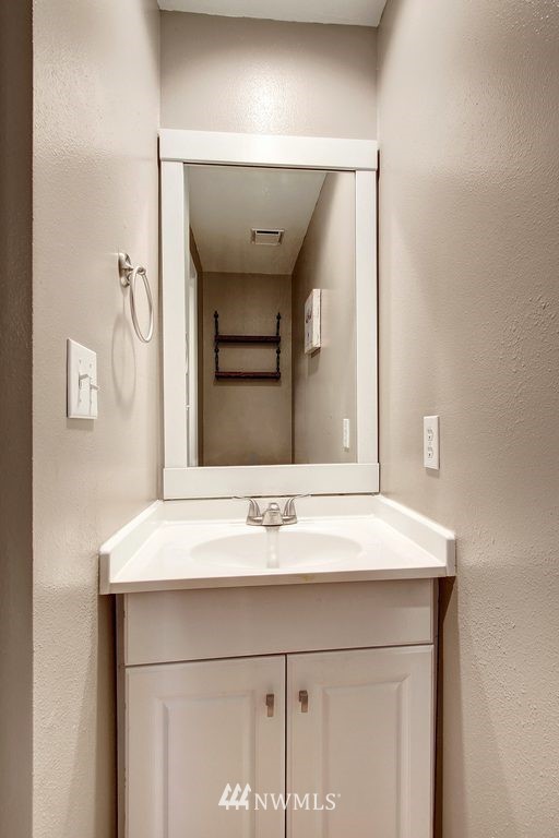 2227 Southeast 8th Place Renton, WA 98057 - Photo 10 of 21 a bathroom with a sink and a mirror