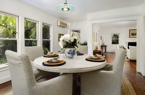 a view of a dining room with furniture window and outside view