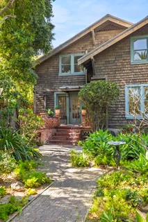 a front view of a house with garden