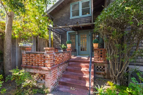 a front view of a house with garden