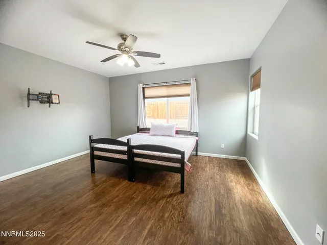 a bedroom with furniture and window