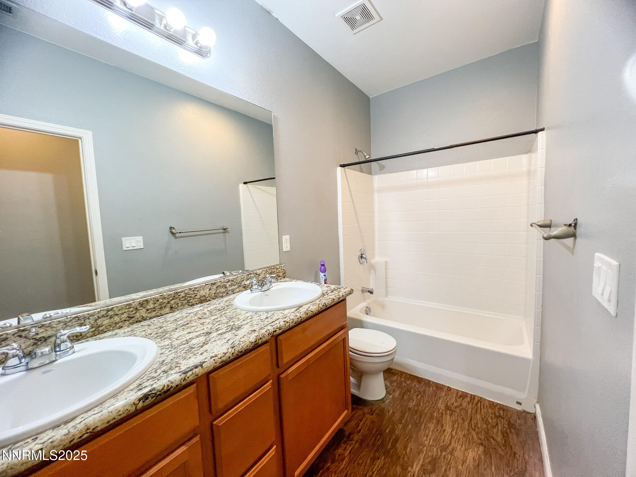 147 Walnut Drive Fernley, NV 89408 - Photo 17 of 31 a bathroom with a granite countertop sink toilet and shower