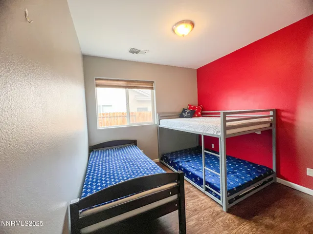 a room with pool table a window and a ceiling fan