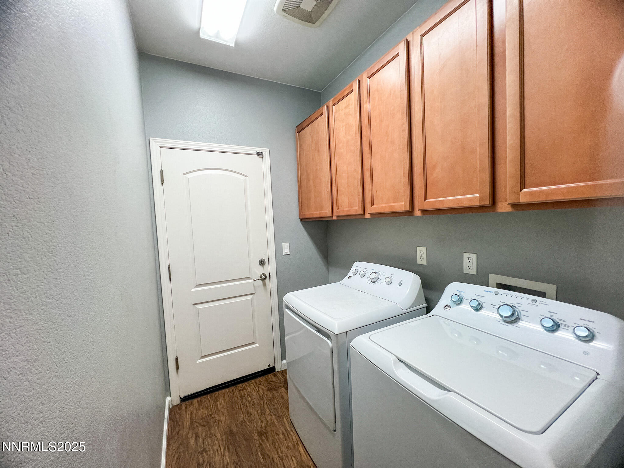 147 Walnut Drive Fernley, NV 89408 - Photo 22 of 31 a view of washer and dryer with kitchen in the background