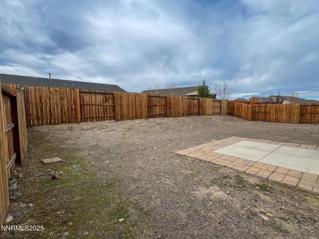 a view of a backyard of the house