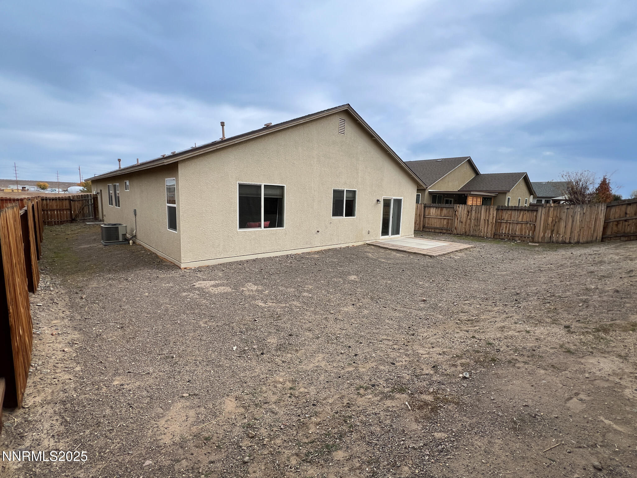 147 Walnut Drive Fernley, NV 89408 - Photo 25 of 31 a view of a house with a backyard