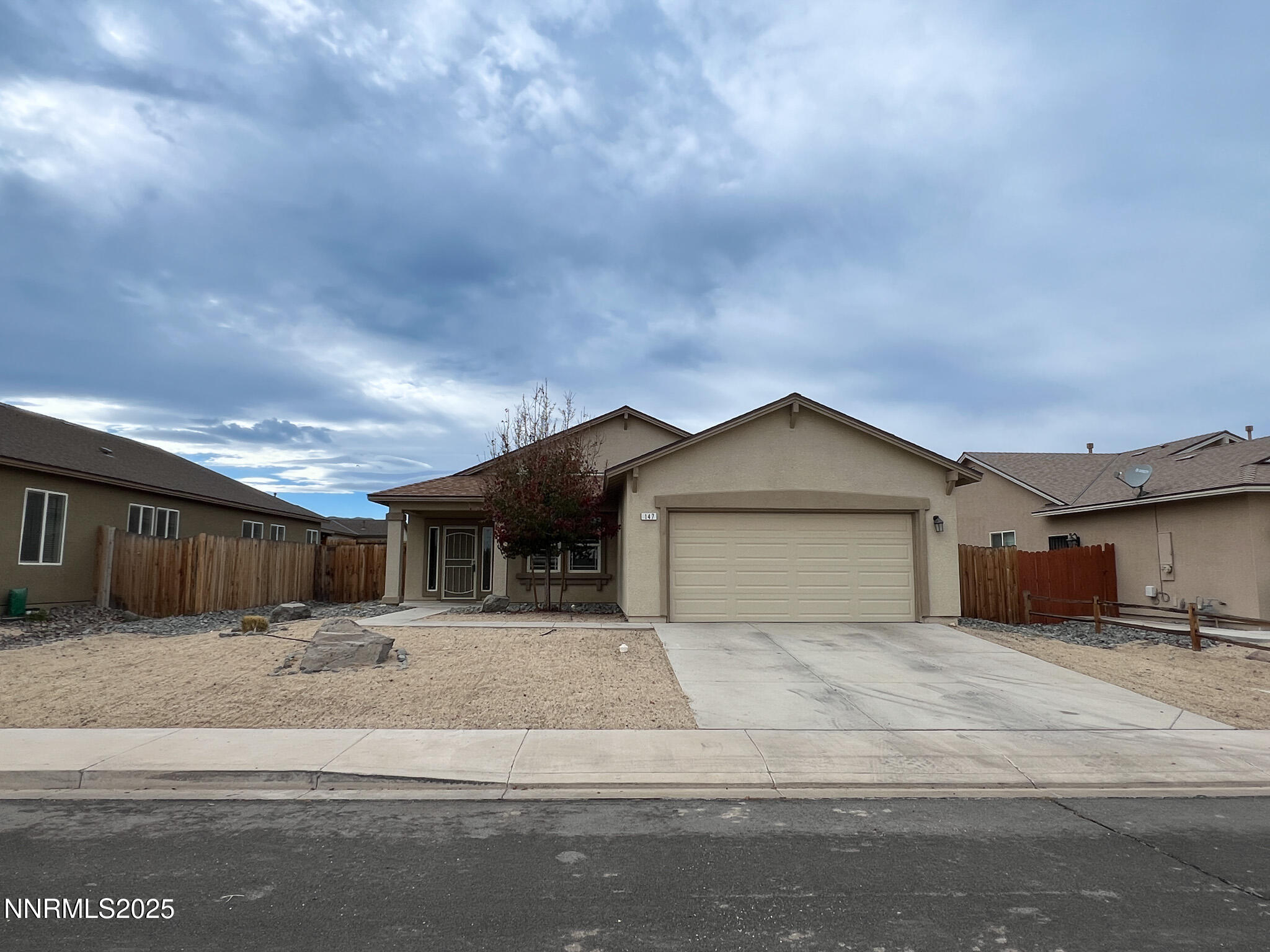 147 Walnut Drive Fernley, NV 89408 - Photo 31 of 31 a view of a house with a yard