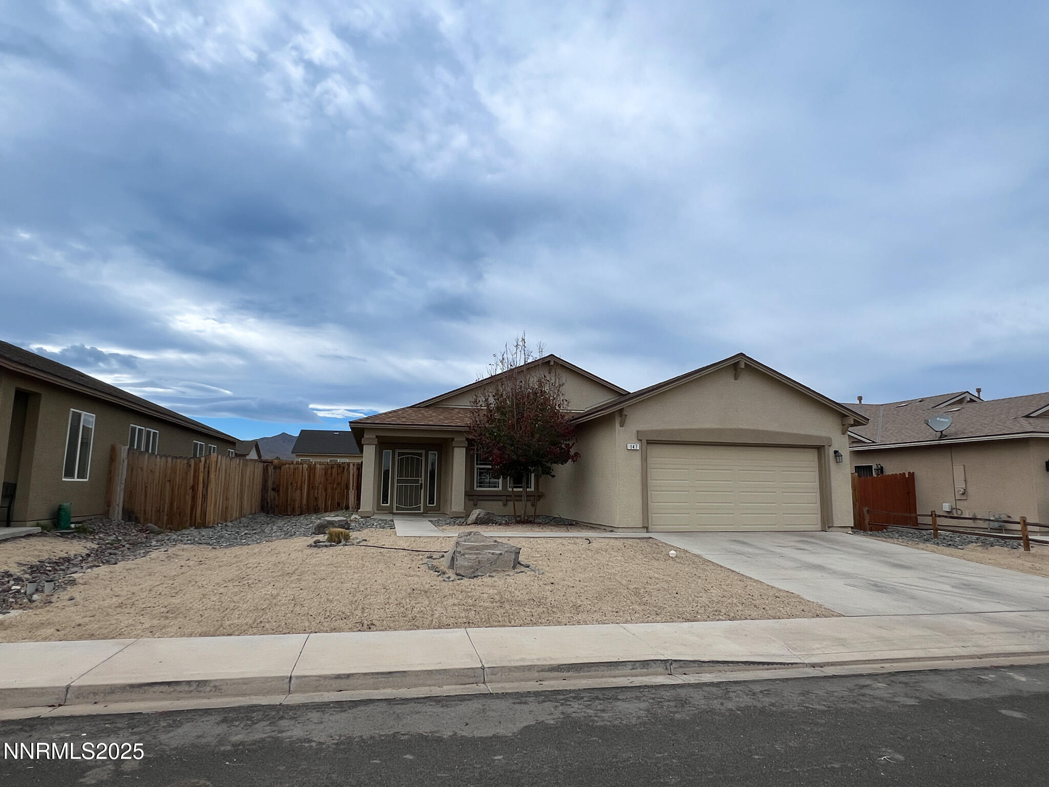 147 Walnut Drive Fernley, NV 89408 - Photo 4 of 31 a house view with a outdoor space