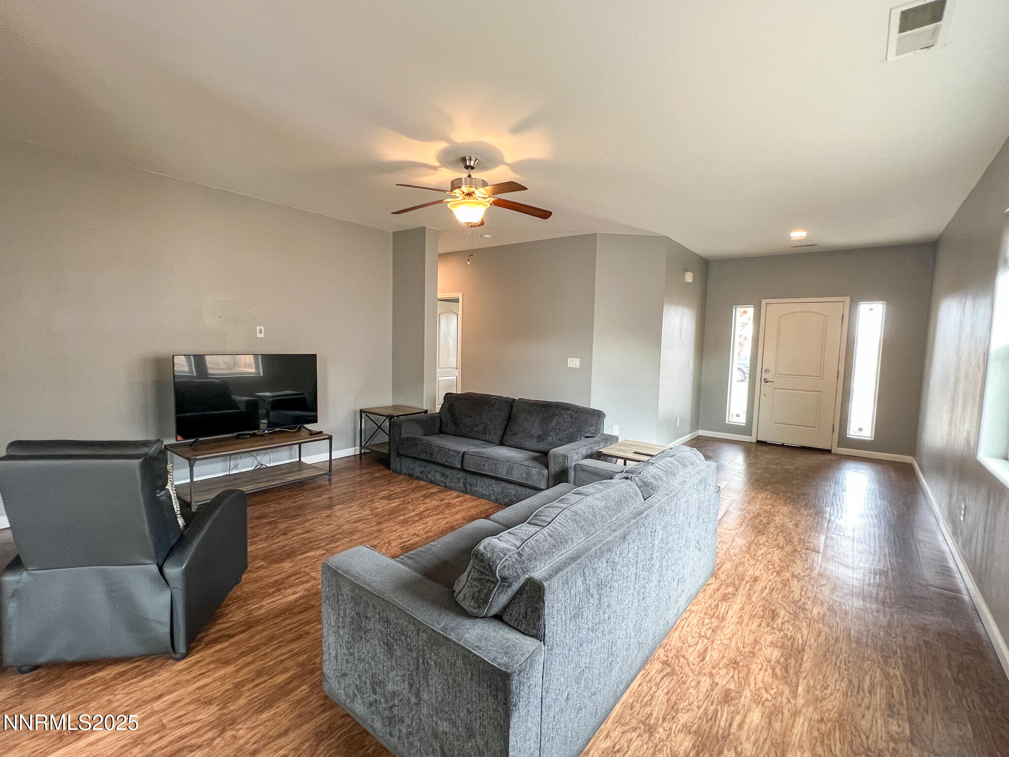 147 Walnut Drive Fernley, NV 89408 - Photo 7 of 31 a living room with furniture and a flat screen tv