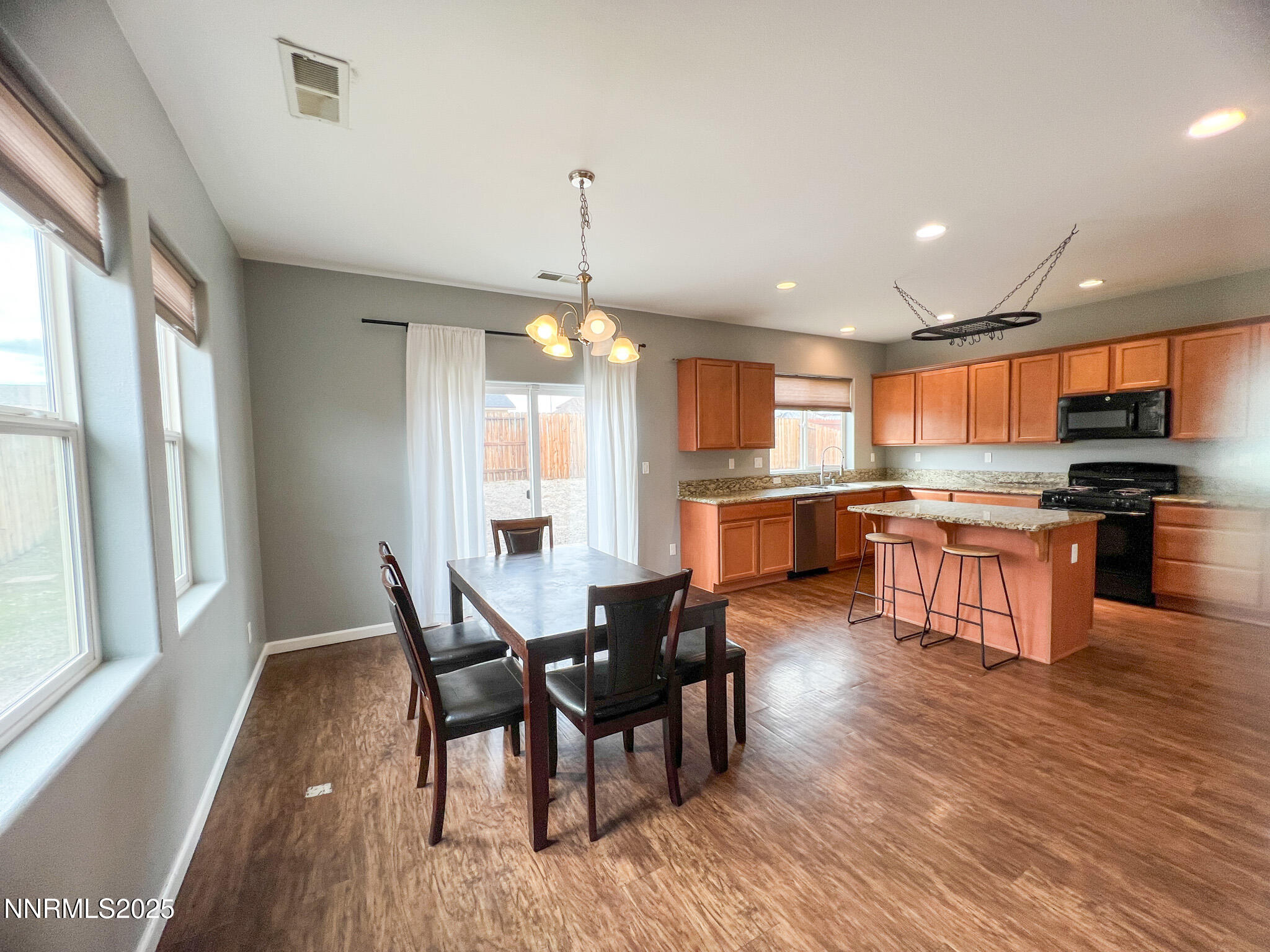 147 Walnut Drive Fernley, NV 89408 - Photo 8 of 31 a view of a dining room with furniture window and wooden floor