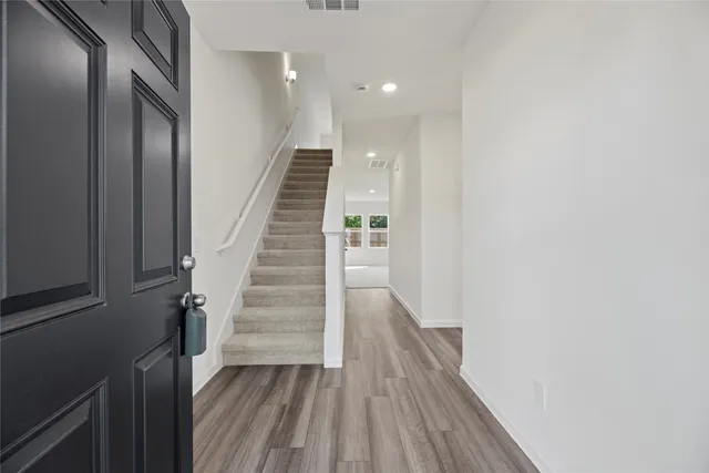 a view of entryway with wooden floor