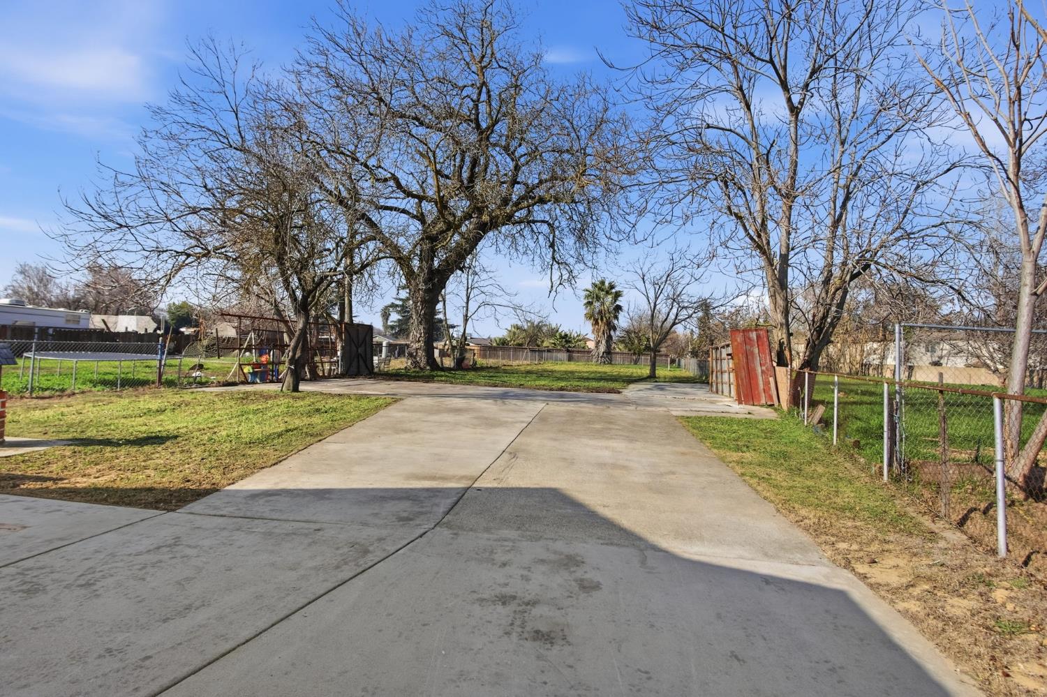 3447 Manchester Road Atwater, CA 95301 - Photo 21 of 31 a view of yard with swimming pool and green space