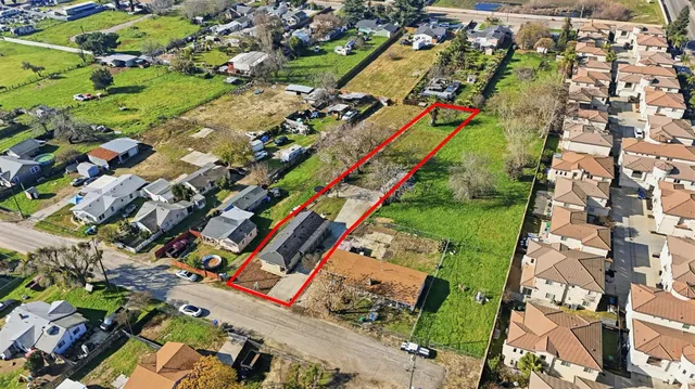 a view of a city with lots of trees and cars