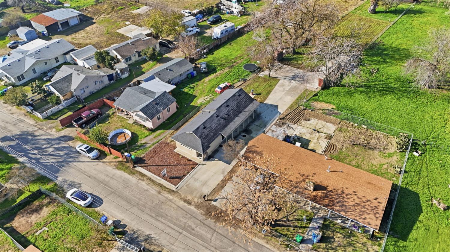 3447 Manchester Road Atwater, CA 95301 - Photo 30 of 31 an aerial view of a house with a yard and street