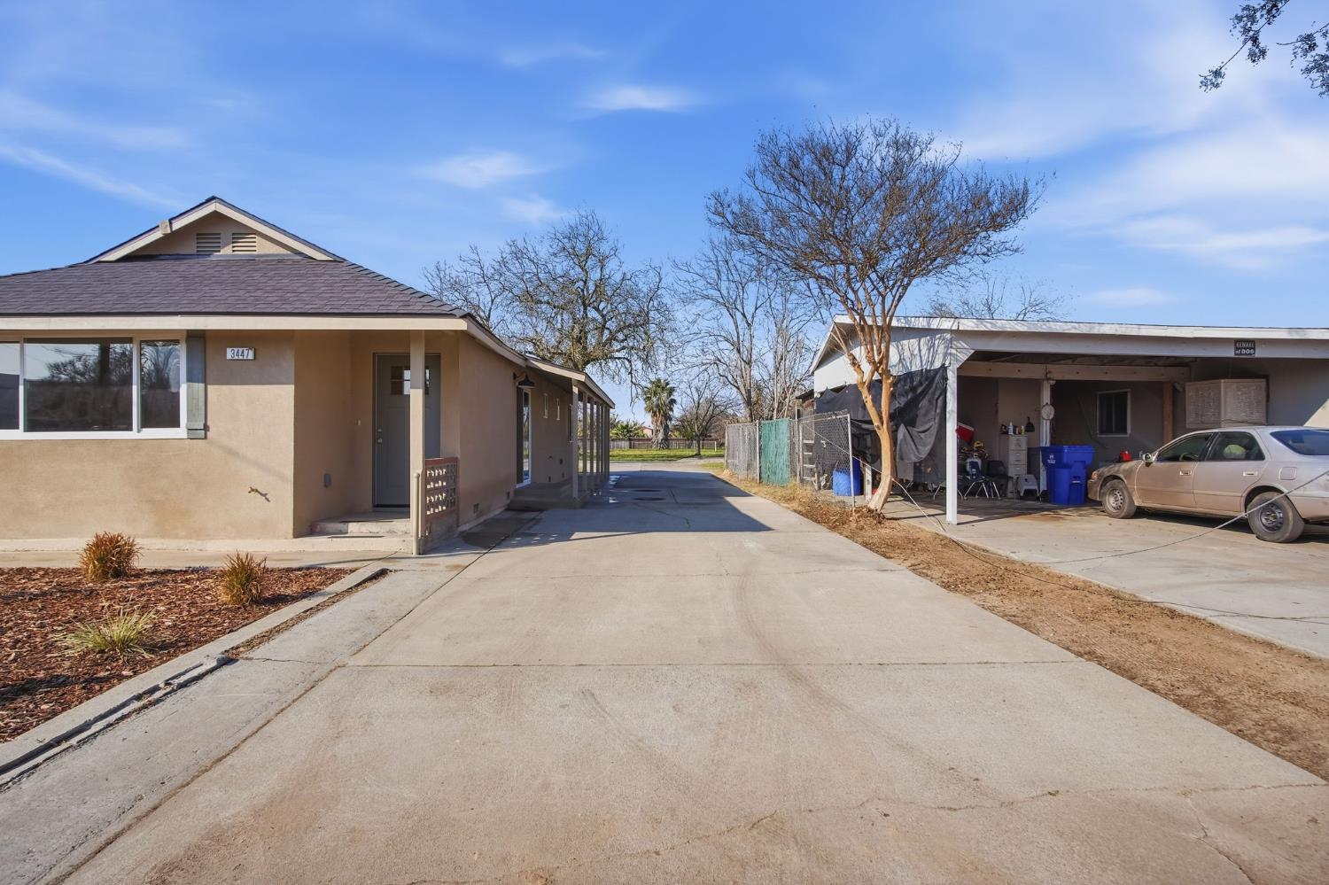 3447 Manchester Road Atwater, CA 95301 - Photo 5 of 31 a front view of a house with a yard and garage