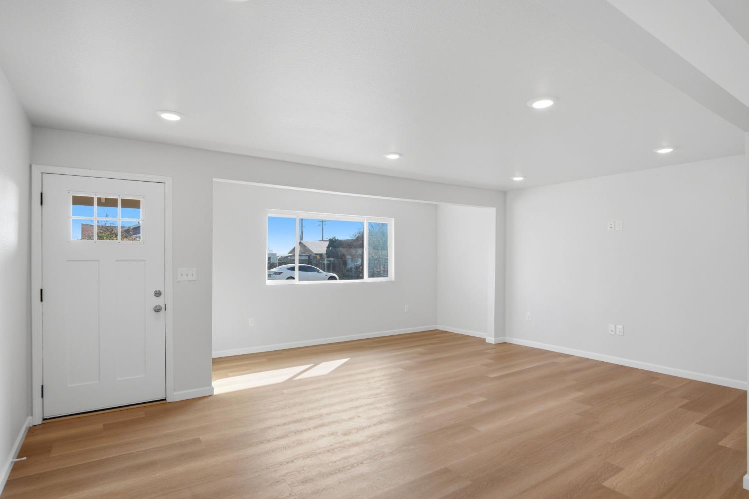 3447 Manchester Road Atwater, CA 95301 - Photo 10 of 31 a view of an empty room with wooden floor and window