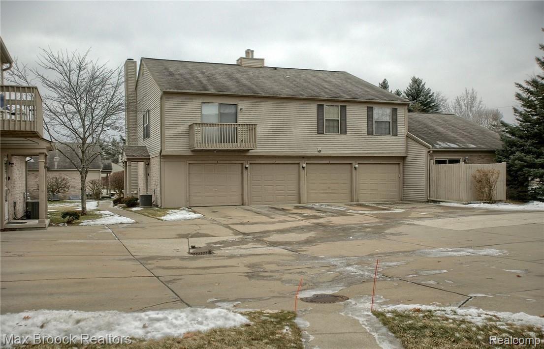 210 Pine Tree Ridge, Unit 4 Waterford, MI 48327 - Photo 20 of 22 23-Rear And Garage.jpg