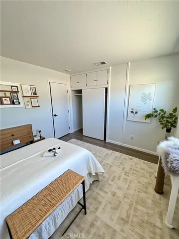 a bedroom with a bed and a cabinets