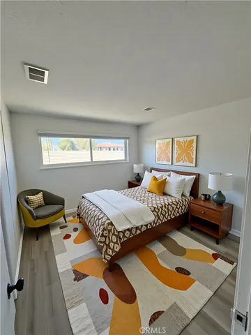 a bedroom with furniture and a window