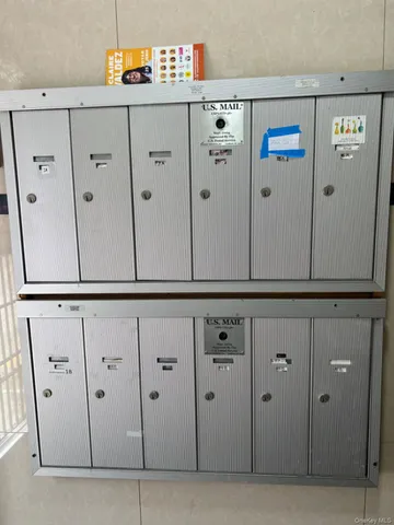 a view of a room with wooden floor and a window