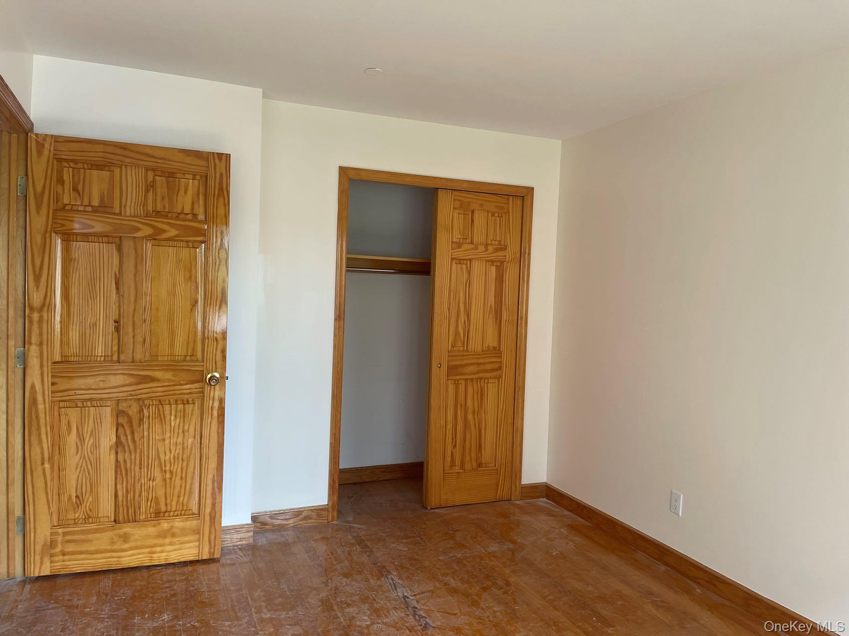 43-07 48th Street, Unit 5A Queens, NY 11104 - Photo 6 of 9 an empty room with windows and closet