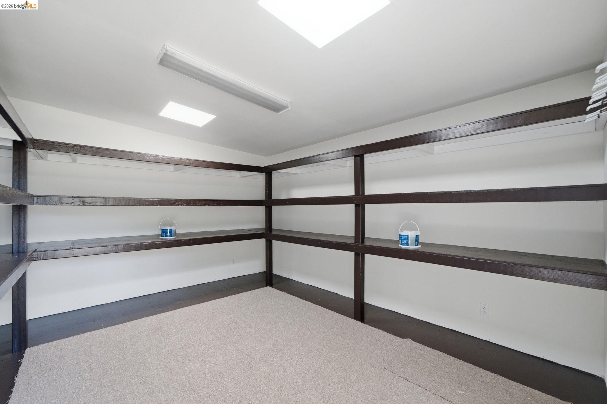 11133 Golf Links Road Oakland, CA 94605 - Photo 50 of 57 Built-in shelving system with dark wood-finish components