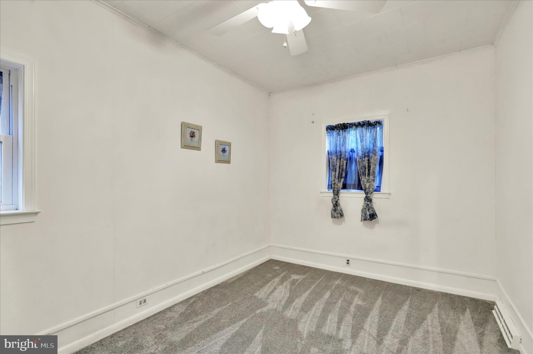 3429 Marion Street Reading, PA 19605 - Photo 16 of 23 wooden floor in an empty room with a window