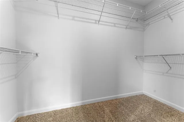 a bathroom with a bathtub shower sink vanity and a mirror