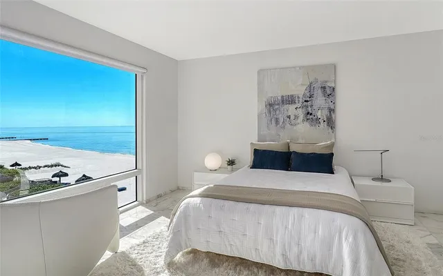 a bedroom with a bed and a view of bathroom