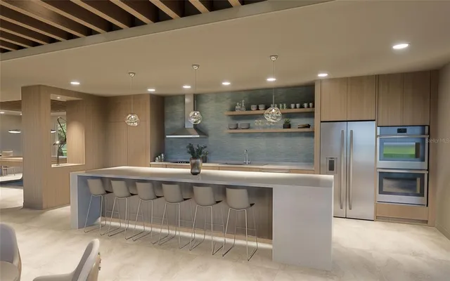 a view of kitchen with kitchen island a sink stainless steel appliances and cabinets