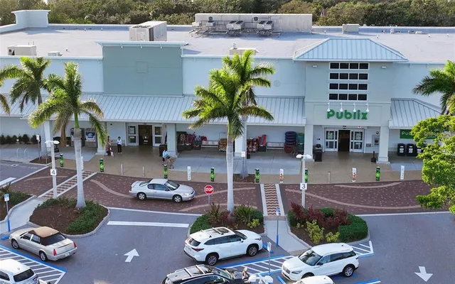 a view of a patio with table and chairs potted plants