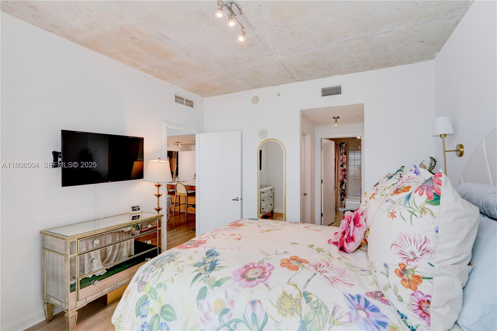 3301 Northeast 1st Avenue, Unit H2304 Miami, FL 33137 - Photo 12 of 27 a bedroom with a bed and flat screen tv