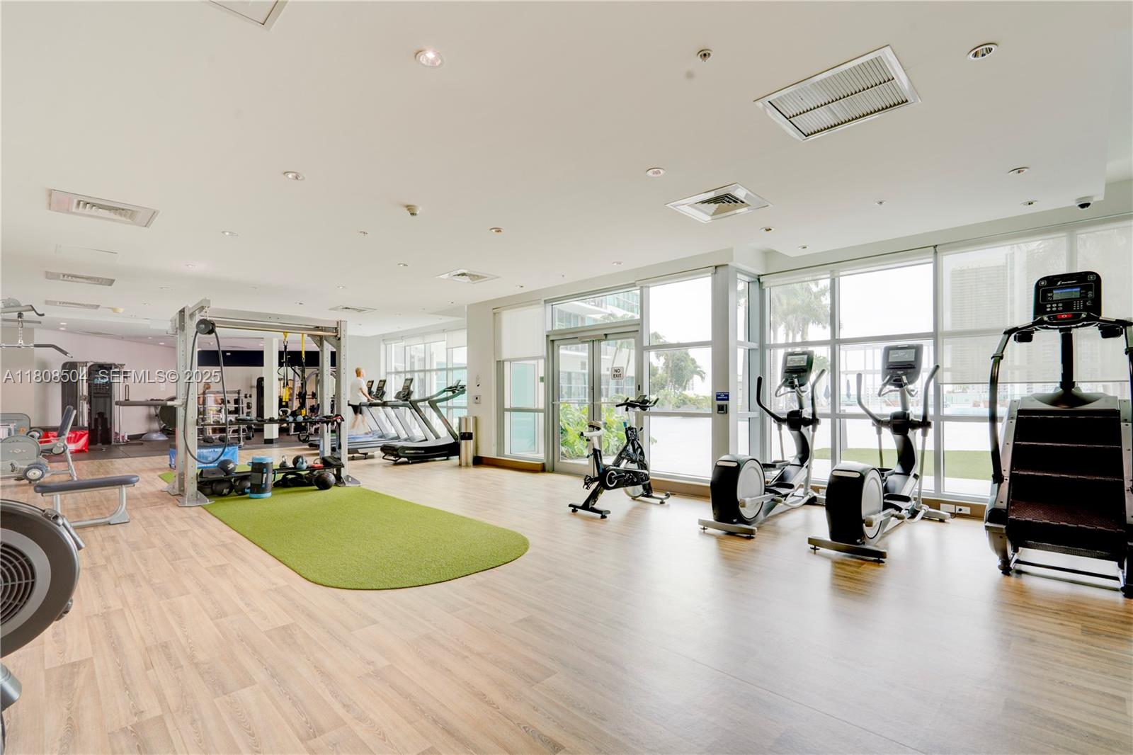 3301 Northeast 1st Avenue, Unit H2304 Miami, FL 33137 - Photo 19 of 27 a view of a room with gym equipment and a large window
