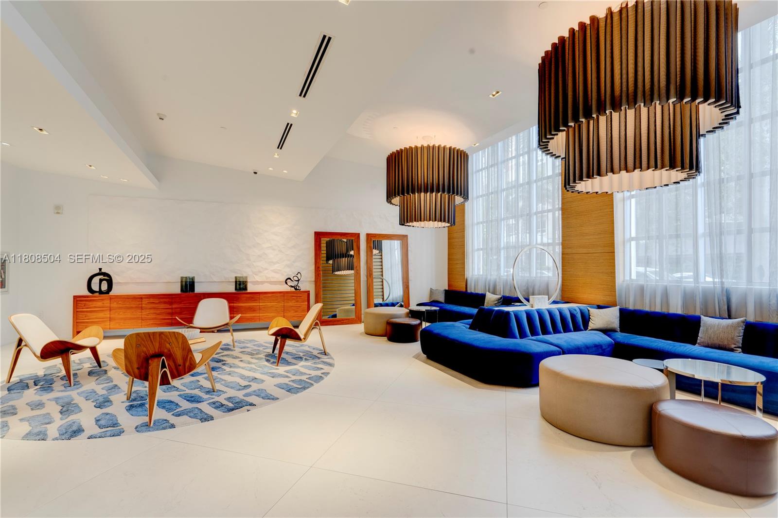 3301 Northeast 1st Avenue, Unit H2304 Miami, FL 33137 - Photo 20 of 27 a living room with furniture kitchen view and a large window