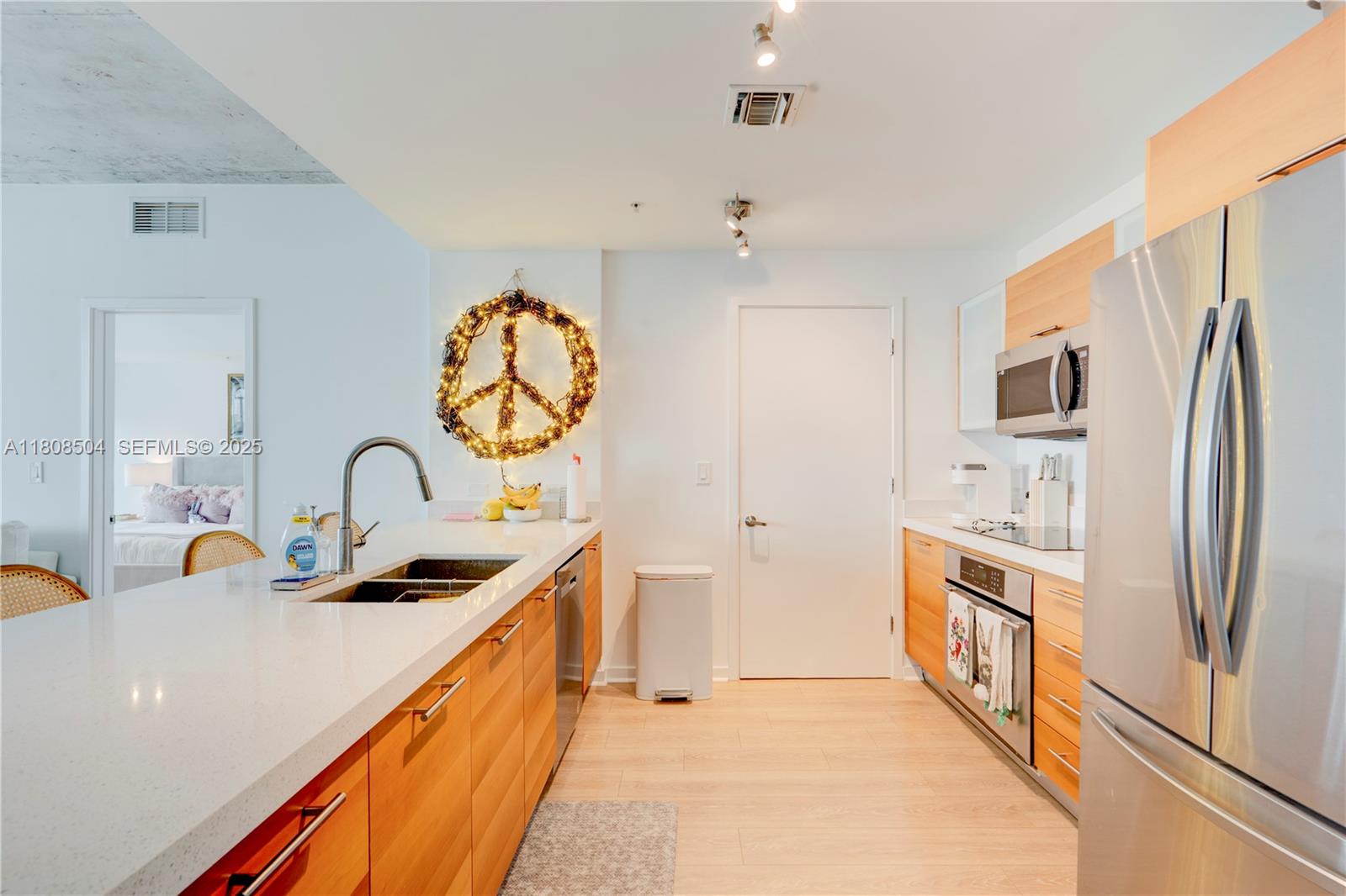 3301 Northeast 1st Avenue, Unit H2304 Miami, FL 33137 - Photo 2 of 27 a kitchen with stainless steel appliances a sink a stove and a refrigerator