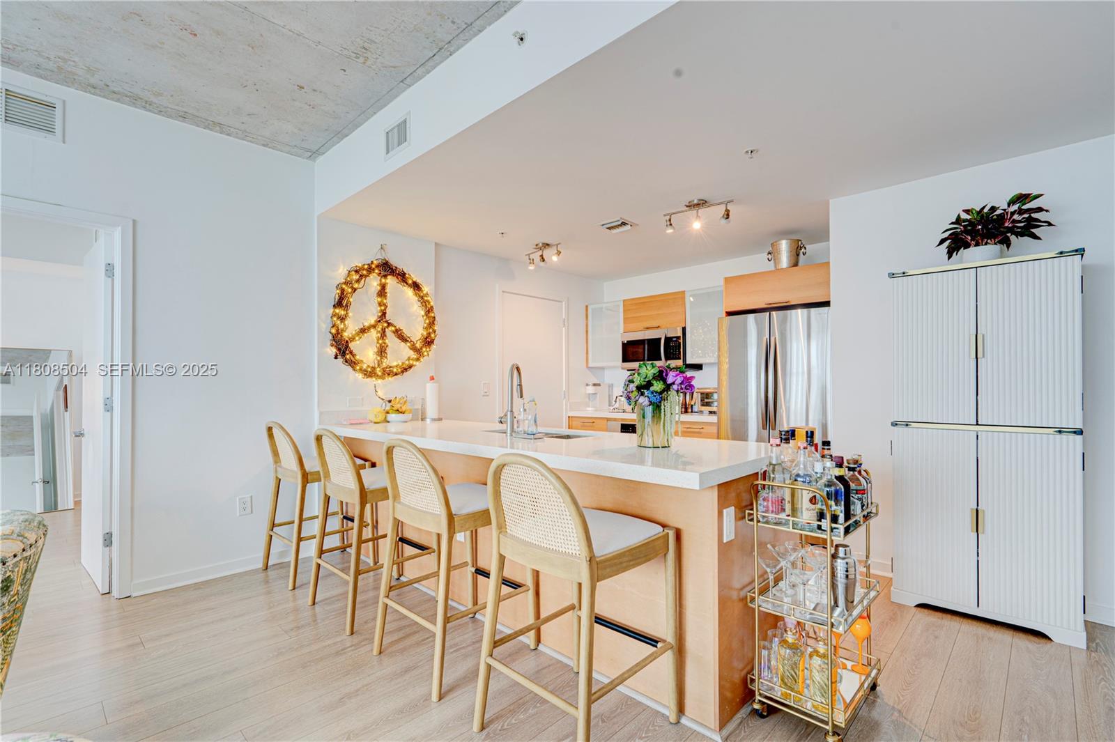 3301 Northeast 1st Avenue, Unit H2304 Miami, FL 33137 - Photo 3 of 27 a view of a dining room with furniture and wooden floor
