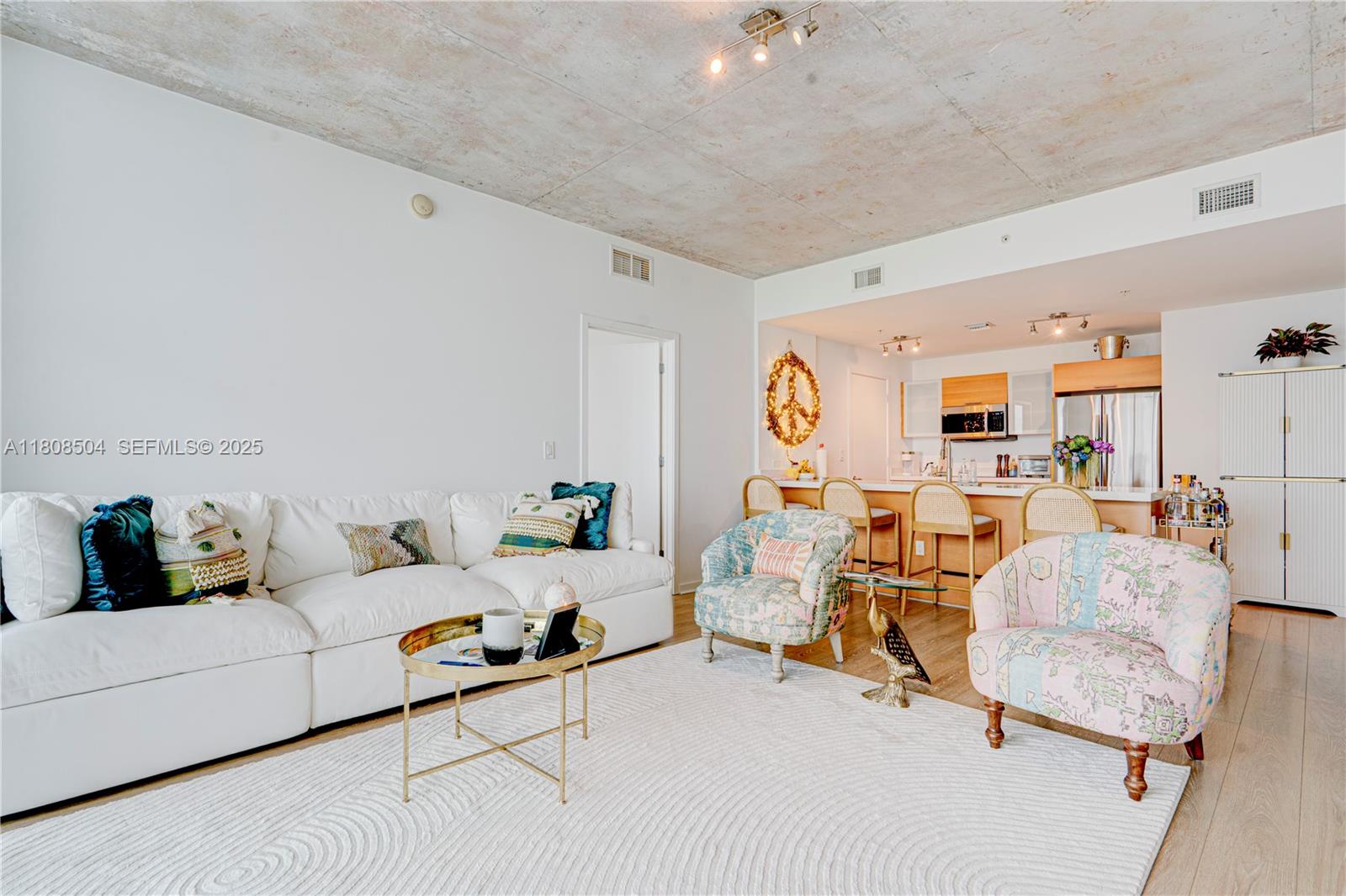 3301 Northeast 1st Avenue, Unit H2304 Miami, FL 33137 - Photo 6 of 27 a living room with furniture and wooden floor