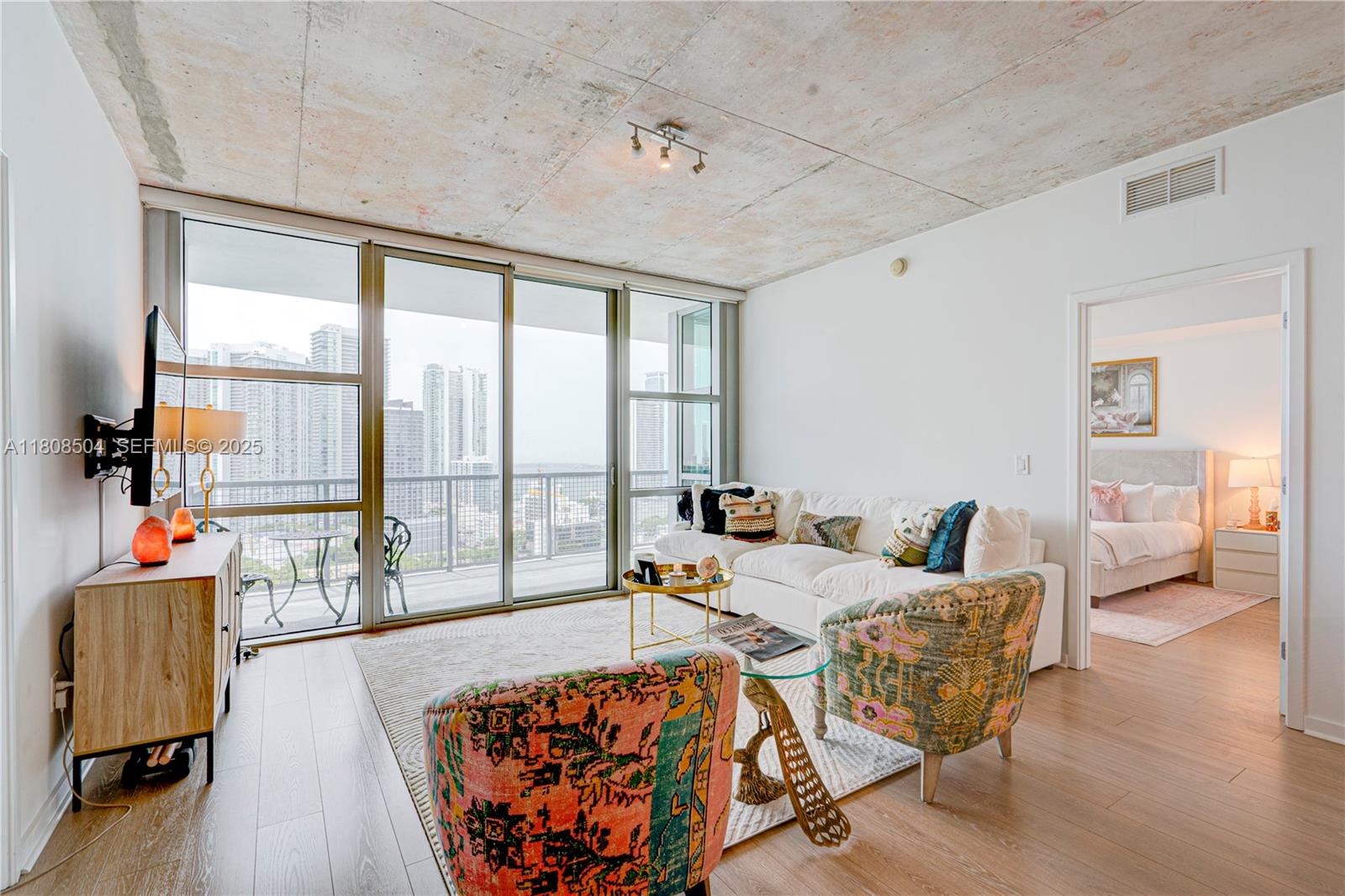 3301 Northeast 1st Avenue, Unit H2304 Miami, FL 33137 - Photo 7 of 27 a living room with furniture and a table